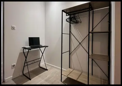 Télévision ou salle de divertissement dans l'établissement Le Cocon