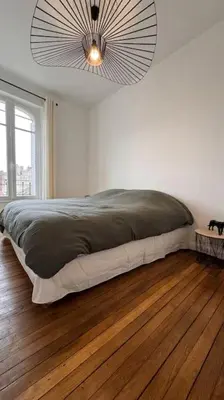 Un ou plusieurs lits dans un hébergement de l'établissement Appartement neuf au centre d'Épernay.