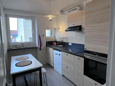 Cuisine ou kitchenette dans l'établissement Appartement Bulles de Lumière