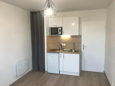 Cuisine ou kitchenette dans l'établissement IKIZEN - Arena Confort - Boulingrin