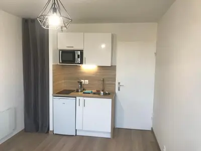 Cuisine ou kitchenette dans l'établissement IKIZEN - Arena Confort - Boulingrin