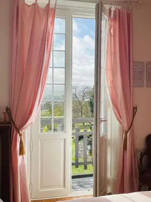 Un ou plusieurs lits dans un hébergement de l'établissement Le Manoir de Sainte-Aulde