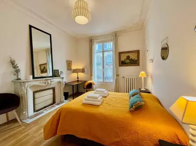 Un ou plusieurs lits dans un hébergement de l'établissement L’Hôtel Particulier des Anges