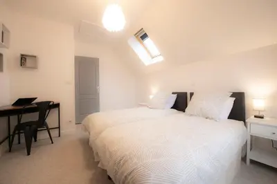 Un ou plusieurs lits dans un hébergement de l'établissement Gîte les hauts de Verberie - appartement calme et lumineux