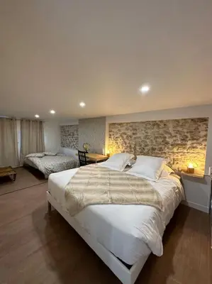 Un ou plusieurs lits dans un hébergement de l'établissement Superbe appartement avec spa privatif