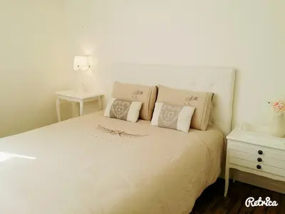 Un ou plusieurs lits dans un hébergement de l'établissement Les Appartements de Champagne