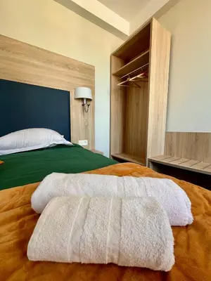 Un ou plusieurs lits dans un hébergement de l'établissement Armor Hotel