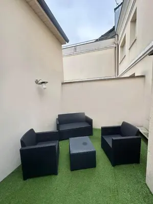 Coin salon dans l'établissement Studio chaleureux centre-ville