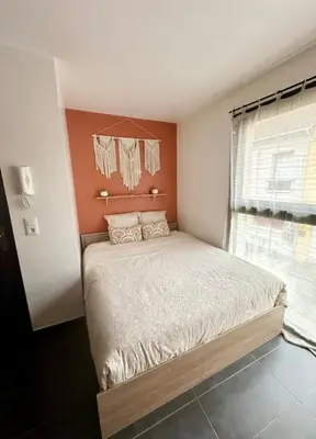 Un ou plusieurs lits dans un hébergement de l'établissement Studio chaleureux centre-ville