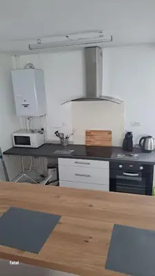 Cuisine ou kitchenette dans l'établissement maison pas loin centre-ville