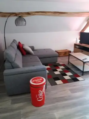 Coin salon dans l'établissement Gîte la Grange