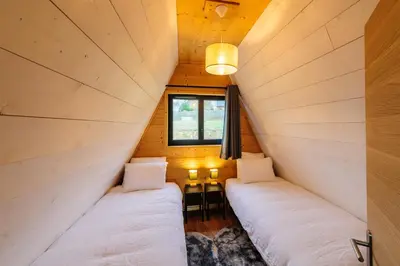 Un ou plusieurs lits dans un hébergement de l'établissement Cottage 3 chambres - Chaleureux chalet pour 6