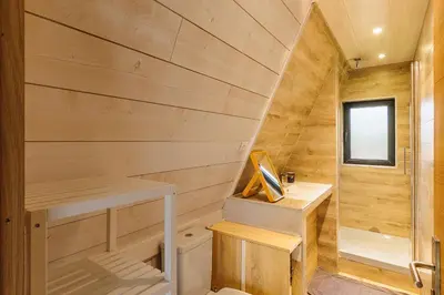 Un ou plusieurs lits dans un hébergement de l'établissement Cottage 2 chambres - Chalet climatisé pour 4