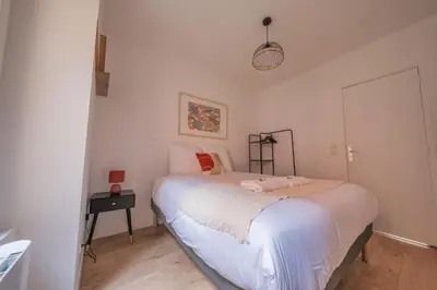 Un ou plusieurs lits dans un hébergement de l'établissement Le Boulingrin - 4 apartments