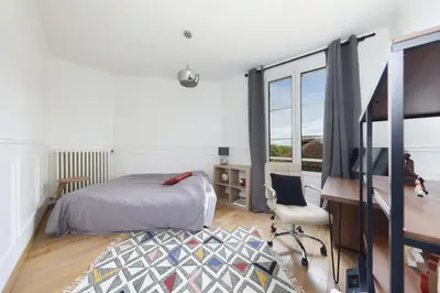 Un ou plusieurs lits dans un hébergement de l'établissement Charmant Appartement dans le centre ville, à 2 minutes du Palais