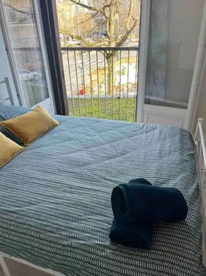 Un ou plusieurs lits dans un hébergement de l'établissement Grand Appartement le Saint Marceaux Reims centre