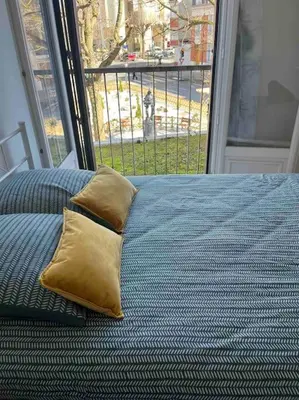 Un ou plusieurs lits dans un hébergement de l'établissement Grand Appartement le Saint Marceaux Reims centre