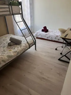 Un ou plusieurs lits dans un hébergement de l'établissement Grand Appartement le Saint Marceaux Reims centre