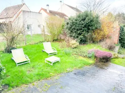 Jardin de l'établissement Bel appartement à 10 minutes de Disney