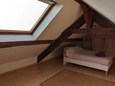 Un ou plusieurs lits dans un hébergement de l'établissement Maison entière et spacieuse Gîte Dovie