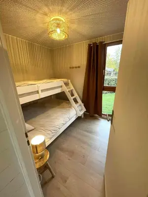 Un ou plusieurs lits dans un hébergement de l'établissement Gîte au calme en pleine nature