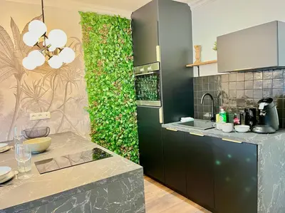 Cuisine ou kitchenette dans l'établissement Floréa Reims avec du charme proche gare et centre