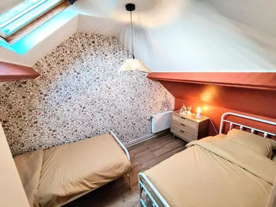 Un ou plusieurs lits dans un hébergement de l'établissement La petite Flânerie