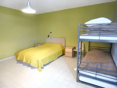 Un ou plusieurs lits dans un hébergement de l'établissement Retraite Champêtre Spacieuse près de Nouart avec Jacuzzi