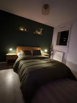 Un ou plusieurs lits dans un hébergement de l'établissement Appartement de Charles