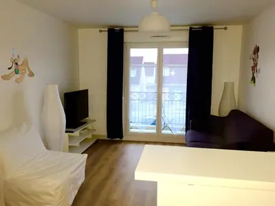 Un ou plusieurs lits dans un hébergement de l'établissement Magic Apartments