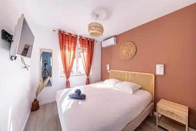 Un ou plusieurs lits dans un hébergement de l'établissement Le Saint tilleul - Maison - Jardin -10' Disneyland