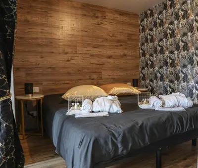 Un ou plusieurs lits dans un hébergement de l'établissement Le Premium - Suite Spa Privatif