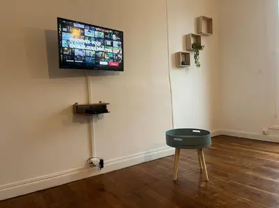 Télévision ou salle de divertissement dans l'établissement Appartement cœur de ville