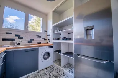 Cuisine ou kitchenette dans l'établissement Trioasis - 3 chambres