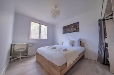 Un ou plusieurs lits dans un hébergement de l'établissement Trioasis - 3 chambres