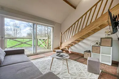 Coin salon dans l'établissement Cottage les Ecuries, pleine nature, proche Disney-Paris