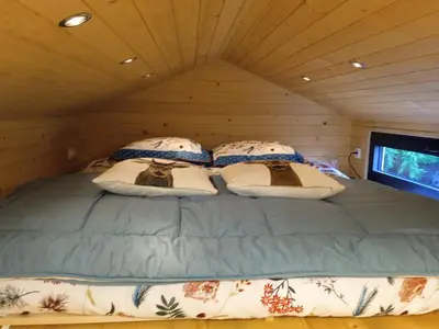 Un ou plusieurs lits dans un hébergement de l'établissement Tiny somniflore