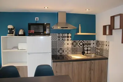 Cuisine ou kitchenette dans l'établissement Bel appartement neuf proche Disneyland et Paris- A proximité de la gare de Meaux