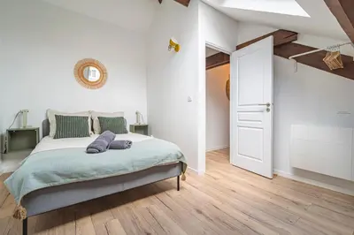 Un ou plusieurs lits dans un hébergement de l'établissement Le Seventies - Exceptionnel 4 chambres & billard