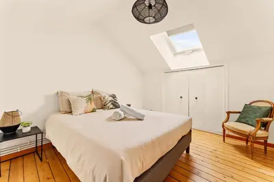 Un ou plusieurs lits dans un hébergement de l'établissement Champagne Escapade - Grand Duplex Hyper Centre