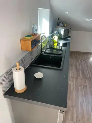 Cuisine ou kitchenette dans l'établissement Au cœur des Vignes