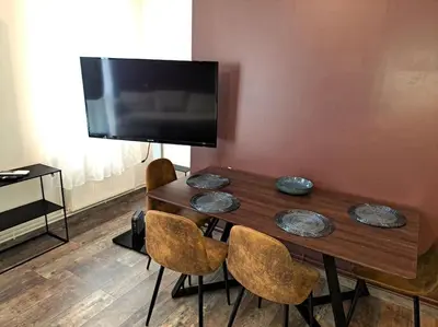 Télévision ou salle de divertissement dans l'établissement Suite Chanzy 69