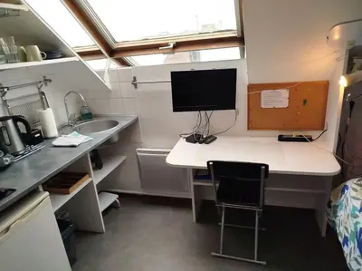 Cuisine ou kitchenette dans l'établissement La studette de Vesle