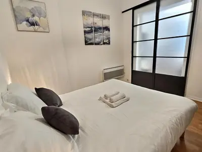 Un ou plusieurs lits dans un hébergement de l'établissement Superbe, T2 Spacieux 50m², Hypercentre, Neuf, RDC