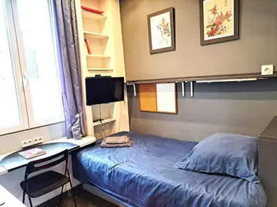Un ou plusieurs lits dans un hébergement de l'établissement Studette Chabaud Rue