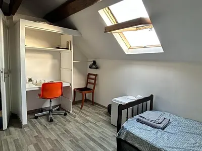 Un ou plusieurs lits dans un hébergement de l'établissement Endroit charmant