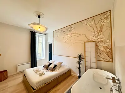 Un ou plusieurs lits dans un hébergement de l'établissement Relax Inn Champagne - Reims Balnéo