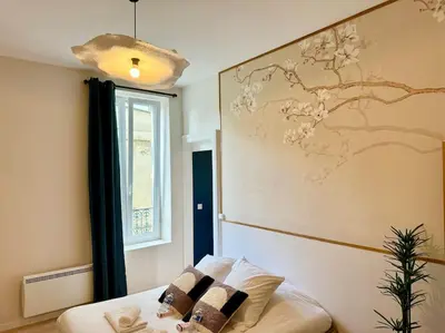 Un ou plusieurs lits dans un hébergement de l'établissement Relax Inn Champagne - Reims Balnéo
