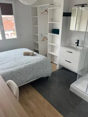 Un ou plusieurs lits dans un hébergement de l'établissement Grand appartement Standing reims centre Arena