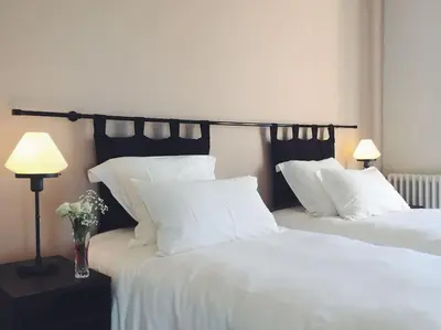 Un ou plusieurs lits dans un hébergement de l'établissement Maison Gabriel - Jacuzzi
